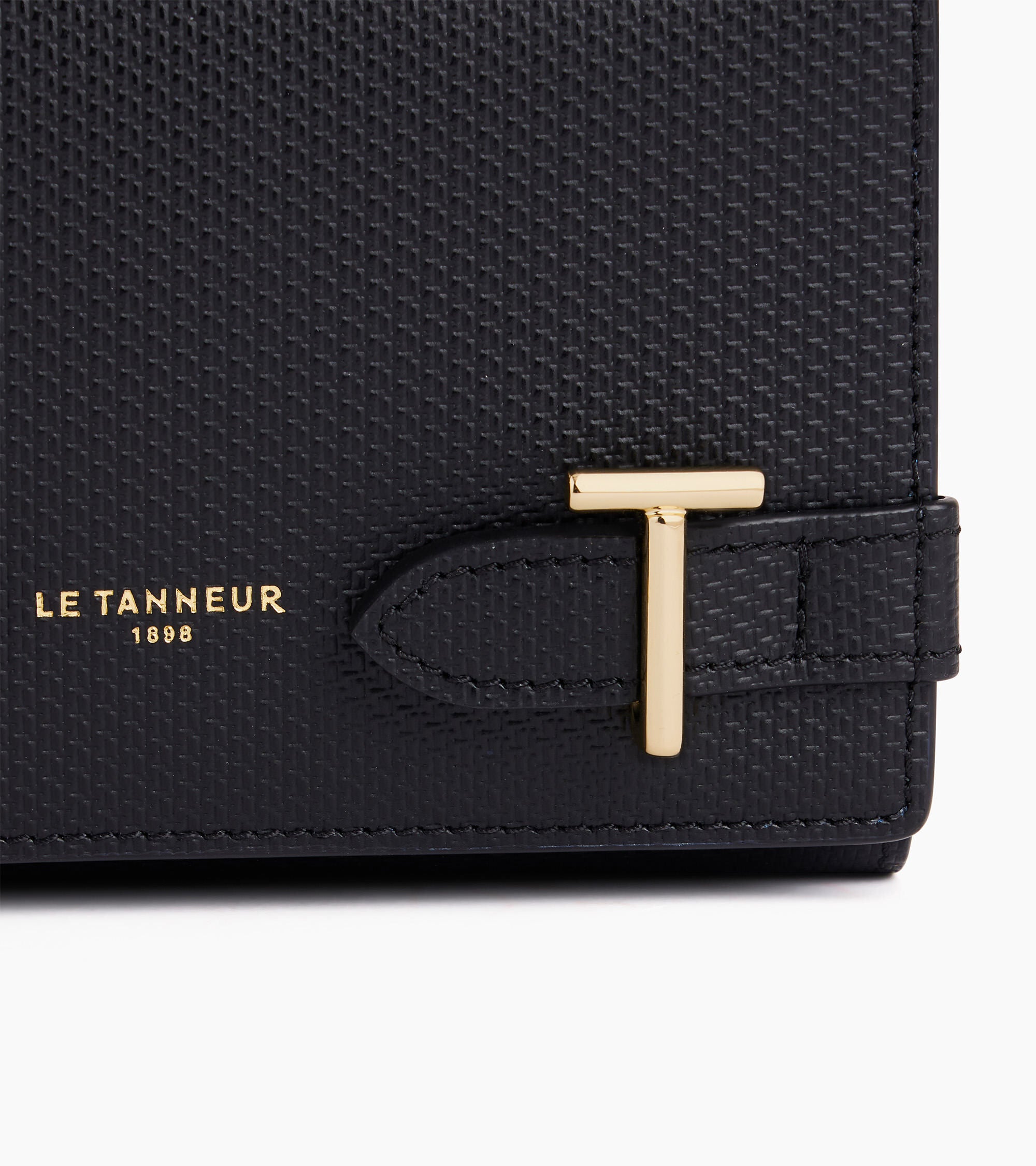 Cartera Émilie de cuero emblemático de la marca con la inicial T